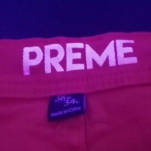 PREME Red pants, with black leather skulls